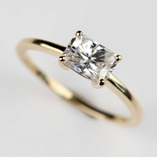 . 7x5mm Emerald Cut East-West Basket Solitaire Engagement Ring